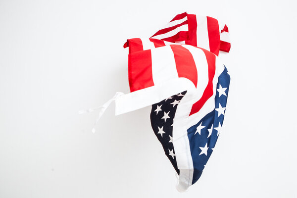 The fall of the flag of the United States. Falling leaf of a gre