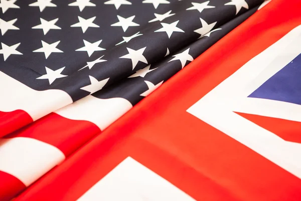The greatness of America and Britain. Two state flag folded in h — Stock Photo, Image