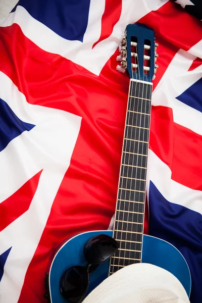 British musicians. Guitar lies on the flag of Britain — Stock Photo, Image
