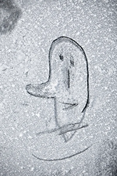 Drawing man face on snow — Stock Photo, Image