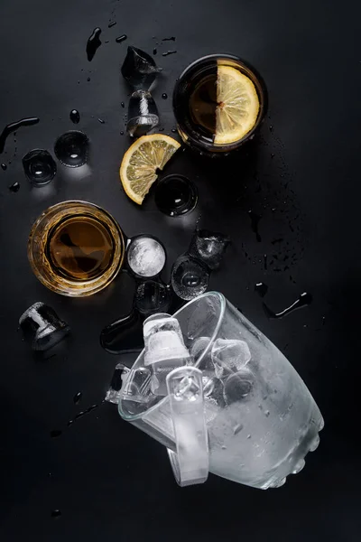 lemon whiskey cocktail with ice bucket