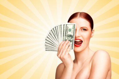Spending money. Creative portrait of a nude girl with beautiful face and body holding hand fan made of 100-dollar currency banknotes on colorful abstract cartoon style background.