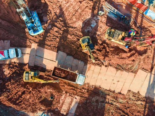 aerial view of excavator heavy machine and mobile Crane tower crane with truck in new construction site