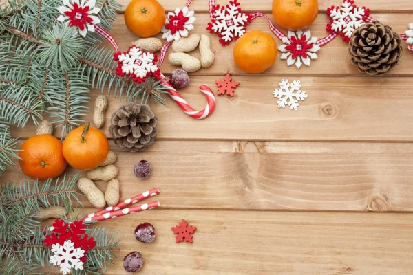 Boże Narodzenie mandarynki i płatki śniegu — Zdjęcie stockowe