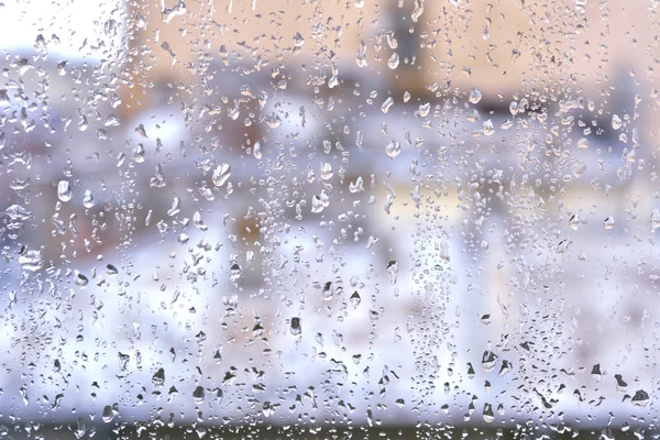 Gotas de lluvia en una ventana —  Fotos de Stock