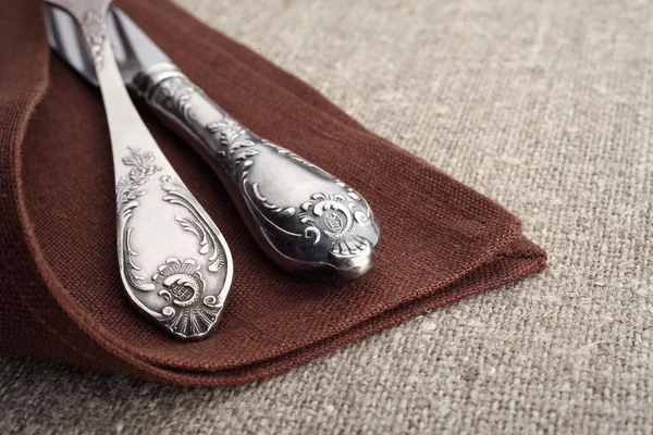 Vintage cutlery on a napkin and tablecloth close-up. — Stock Photo, Image