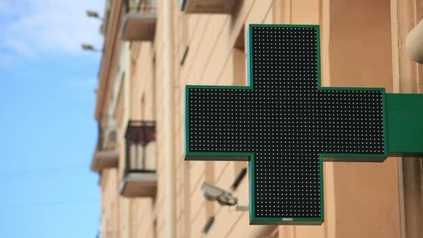 Pharmacy sign with LED backlight on the street. — Stock Video