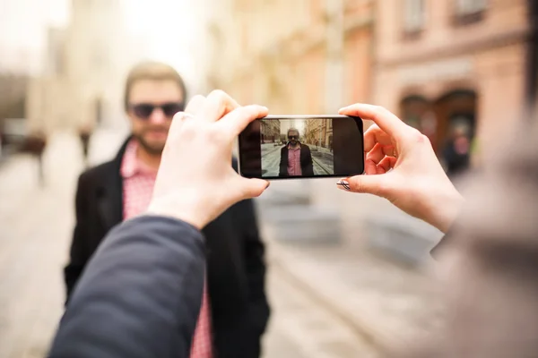 Taking a photo of young man — Stock Photo, Image