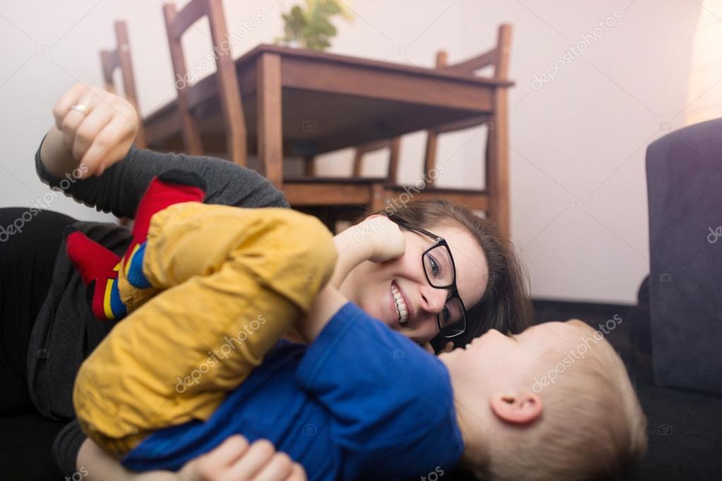 Tickling on the floor — Stock Photo © InnerVisionPRO 109438662