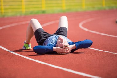 Tired sportsman after workout clipart