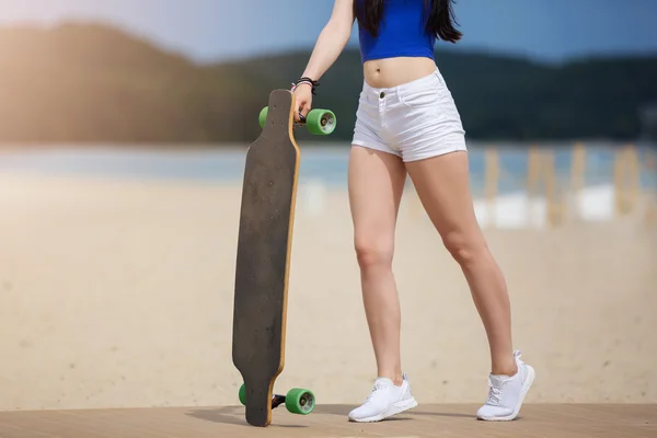 Longboard with green wheels — Stock Photo, Image