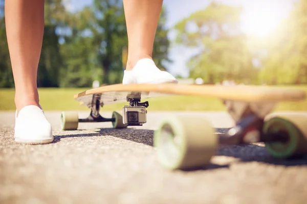 Longboard with action camera — Stock Photo, Image