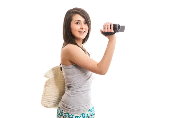 Young cute tourist with video camera - isolated — Stock Photo, Image