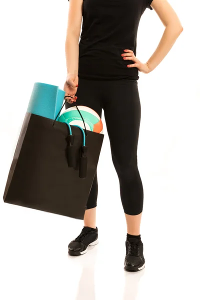 Woman standing with shopping bag — Stock Photo, Image