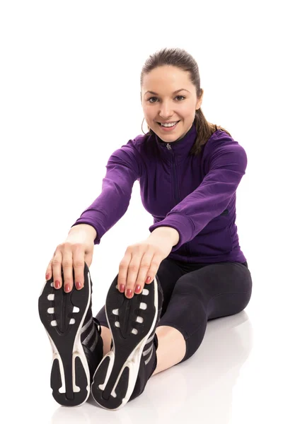 Smiling woman stretching — Stock Photo, Image