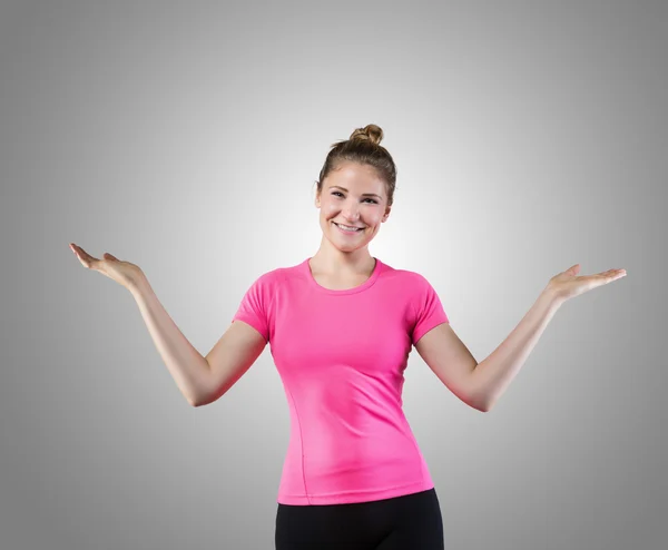 Cheerful young woman with raised arms juggling — Stock Photo, Image