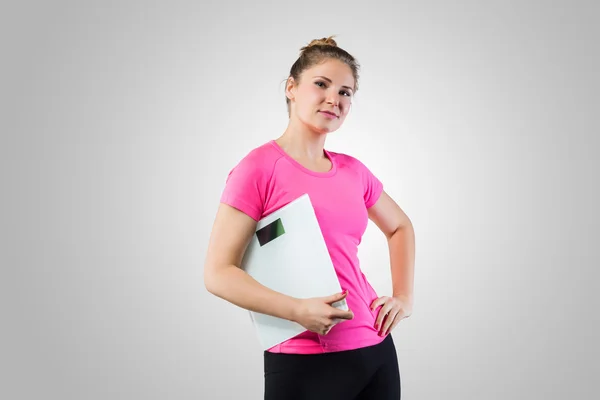 Confindent woman with weight scale — Stock Photo, Image