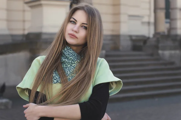 Young blonde woman in a coat. Closeup shot — Stock Photo, Image