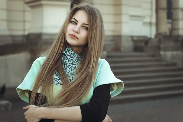 Portrait of pretty blonde woman in a coat — Stock Photo, Image