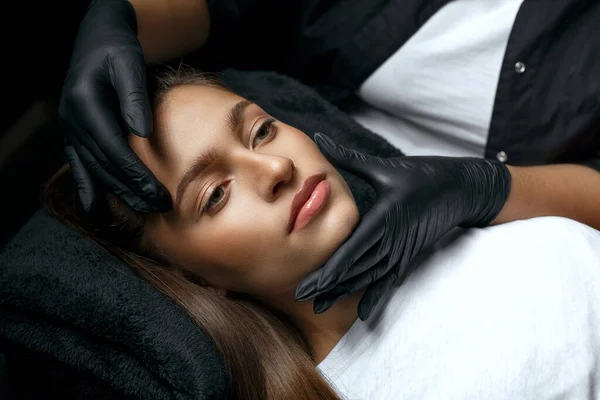 Beauty Stylist Black Gloves Touching Pretty Woman Face Lip Augmentation — Stock Photo, Image