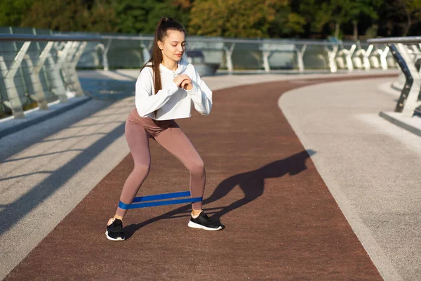 Sporty Woman Exercising Rubber Band Bridge Free Space Text — Stock Photo, Image