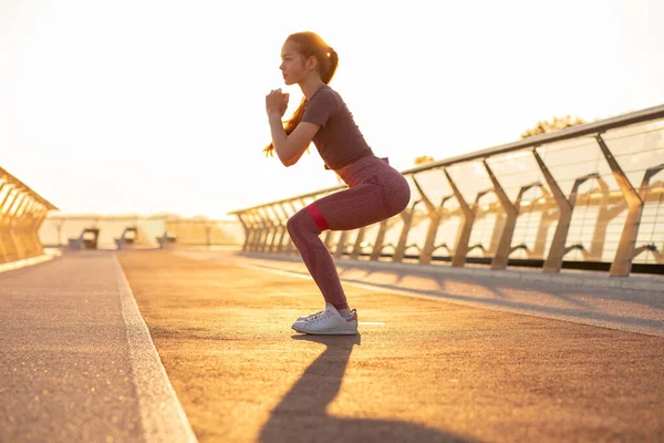 Athletic Redhead Woman Doing Squats Rubber Band Morning Sun Light — Stock Photo, Image