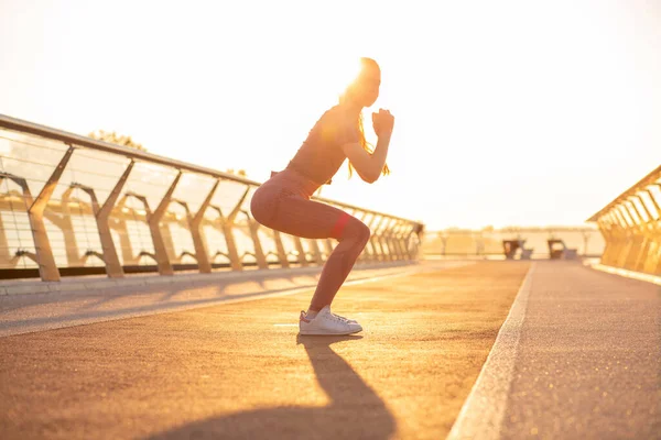 Slim Fit Redhead Woman Doing Squats Rubber Band Morning Sun — Stock Photo, Image