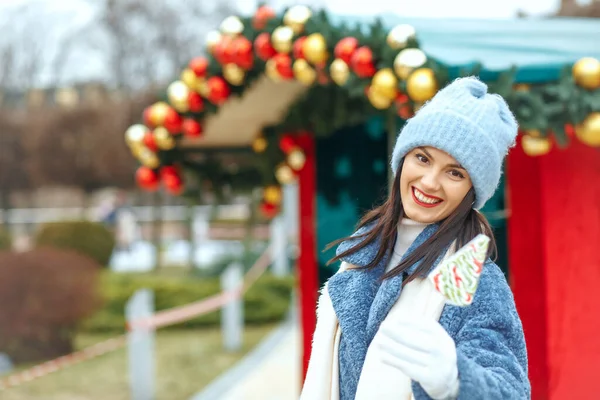 Awesome Smiling Woman Holding Candy Christmas Market Empty Space — Stock Photo, Image