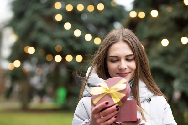 Pleased Blond Woman Holding Gift Box Street Empty Space — Stock Photo, Image