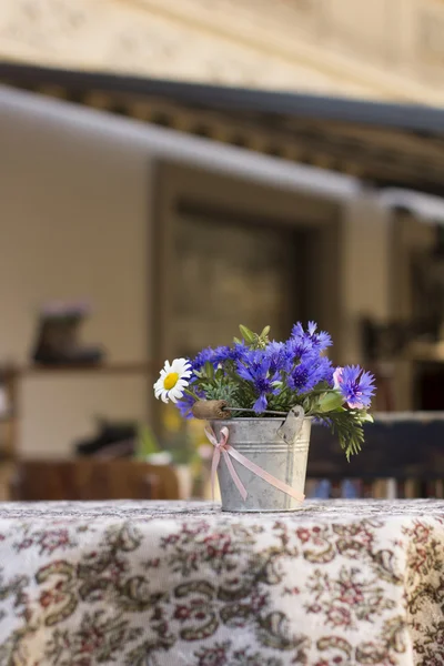 Flowers on the table on a  street cafe, Lviv, Ukraine