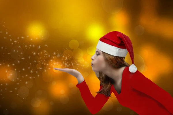 Vánoční dívka foukání — Stock fotografie