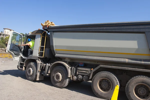 Truck and bulldozer work in the quarry — Stock Photo, Image