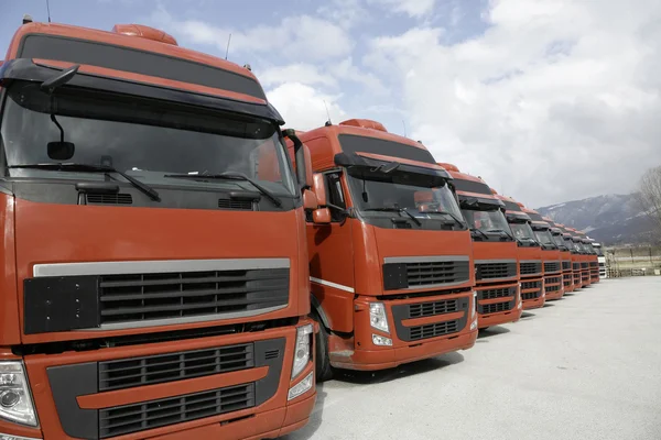 Corporate fleet trucks lined — Stock Photo, Image