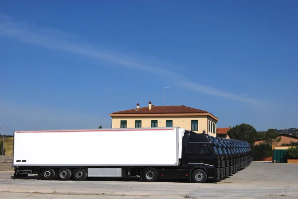 Corporate fleet trucks lined — Stock Photo, Image