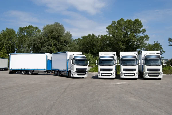 Corporate fleet trucks lined — Stock Photo, Image