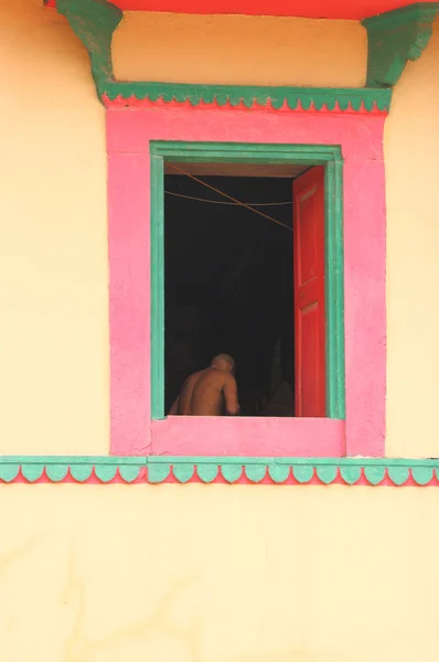 Indian man seen through an ancient window india — Stock Photo, Image