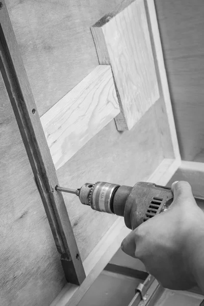 A carpenter drilling — Stock Photo, Image