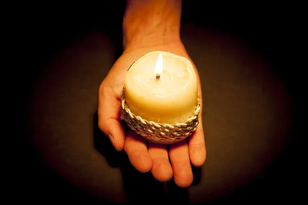 Hands with candle — Stock Photo, Image