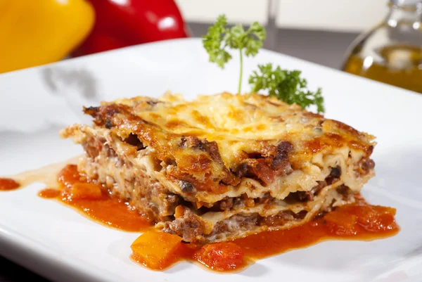 Italian lasagna on a square plate — Stock Photo, Image
