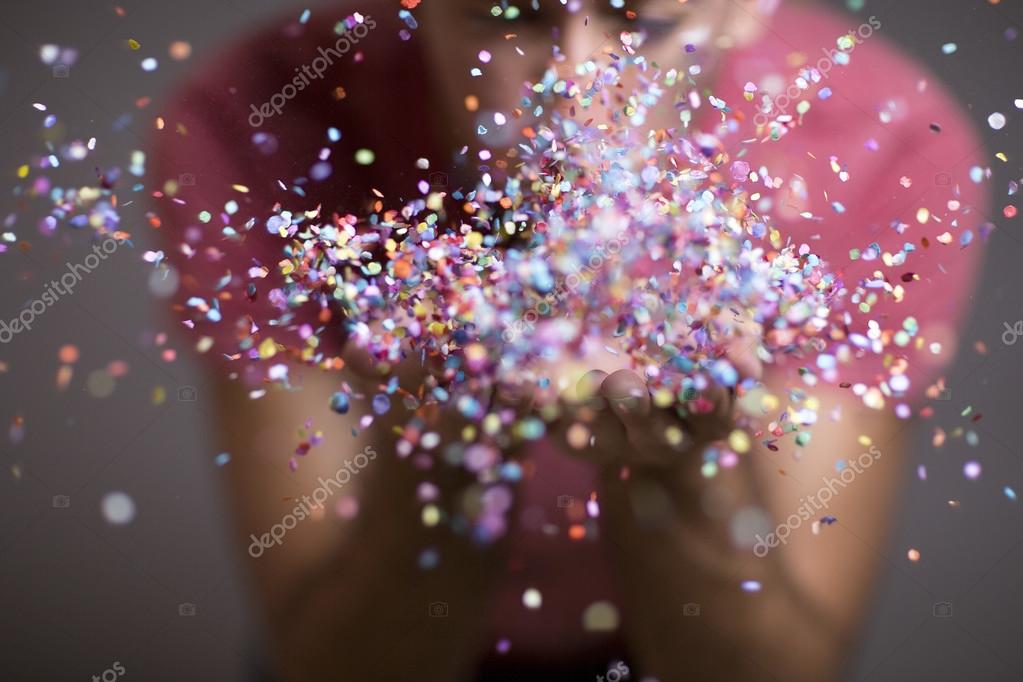 Festive young man throwing confetti ⬇ Stock Photo, Image by