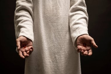 Nasıralı İsa, dirildikten sonra karanlık bir gecede dua ederken ellerindeki yaraları gösteriyor..