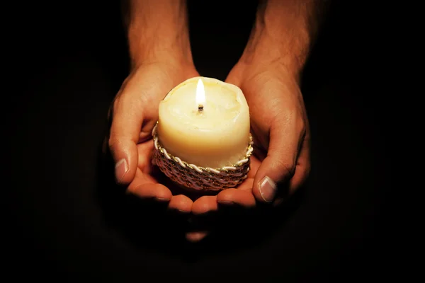 Hands with candle — Stock Photo, Image