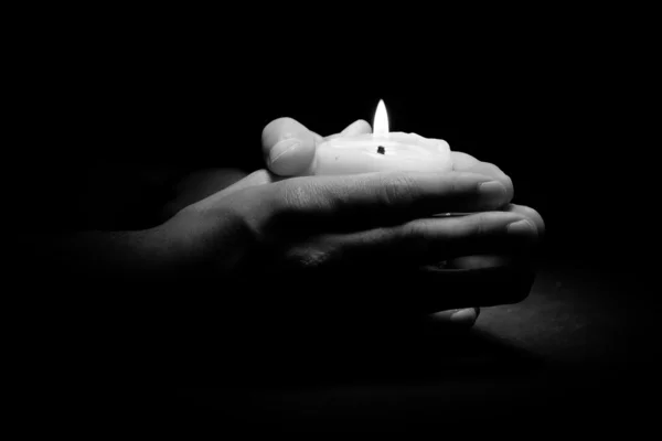 Hands with candle — Stock Photo, Image