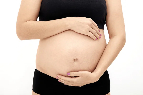Kobiety w ciąży, dotykając jej brzuch — Zdjęcie stockowe