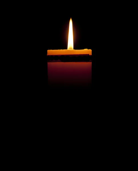 Candle on black background — Stock Photo, Image