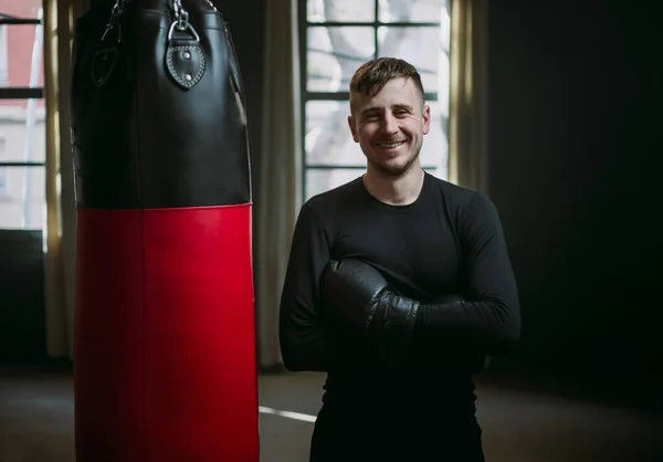 The man is an athlete boxing in the gym. Boxer practicing punches in the ring. Shadow-boxing. The athlete strikes with a punching bag. 4k video Royalty Free Stock Photos