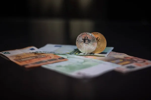 Cryptocurrency bitcoin. Money and bitcoin. Bitcoin is a close plan. Euro banknotes Stock Photo