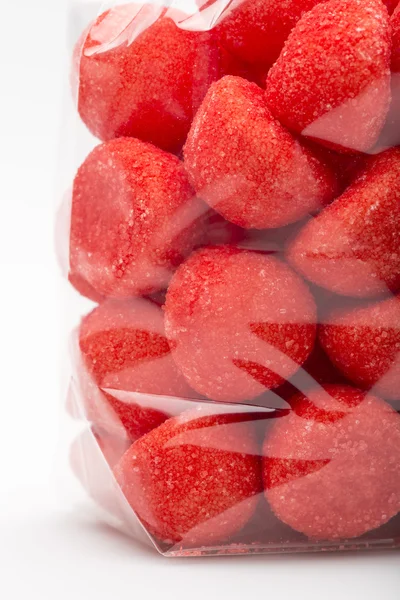 Closeup on candy strawberries in  luxury plastic bag — Stock Photo, Image