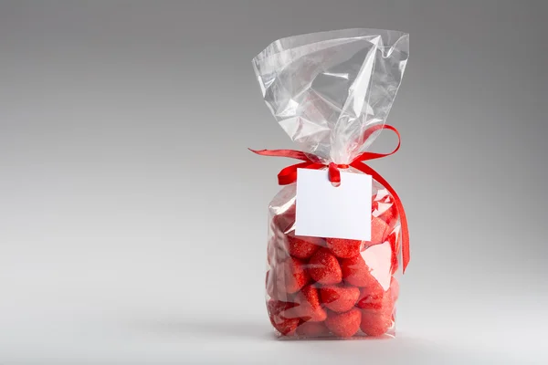 Luxury gift of red candies with blank label and copy space — Stock Photo, Image