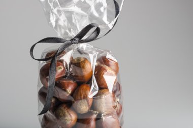 Luxury bag of sweet chestnuts with ribbon and copy space